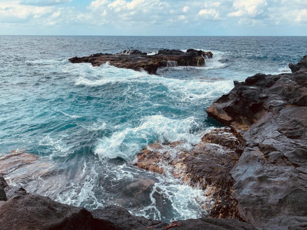 Dramatic waves crash against the rocky coastline of Arucas, Canary Islands.